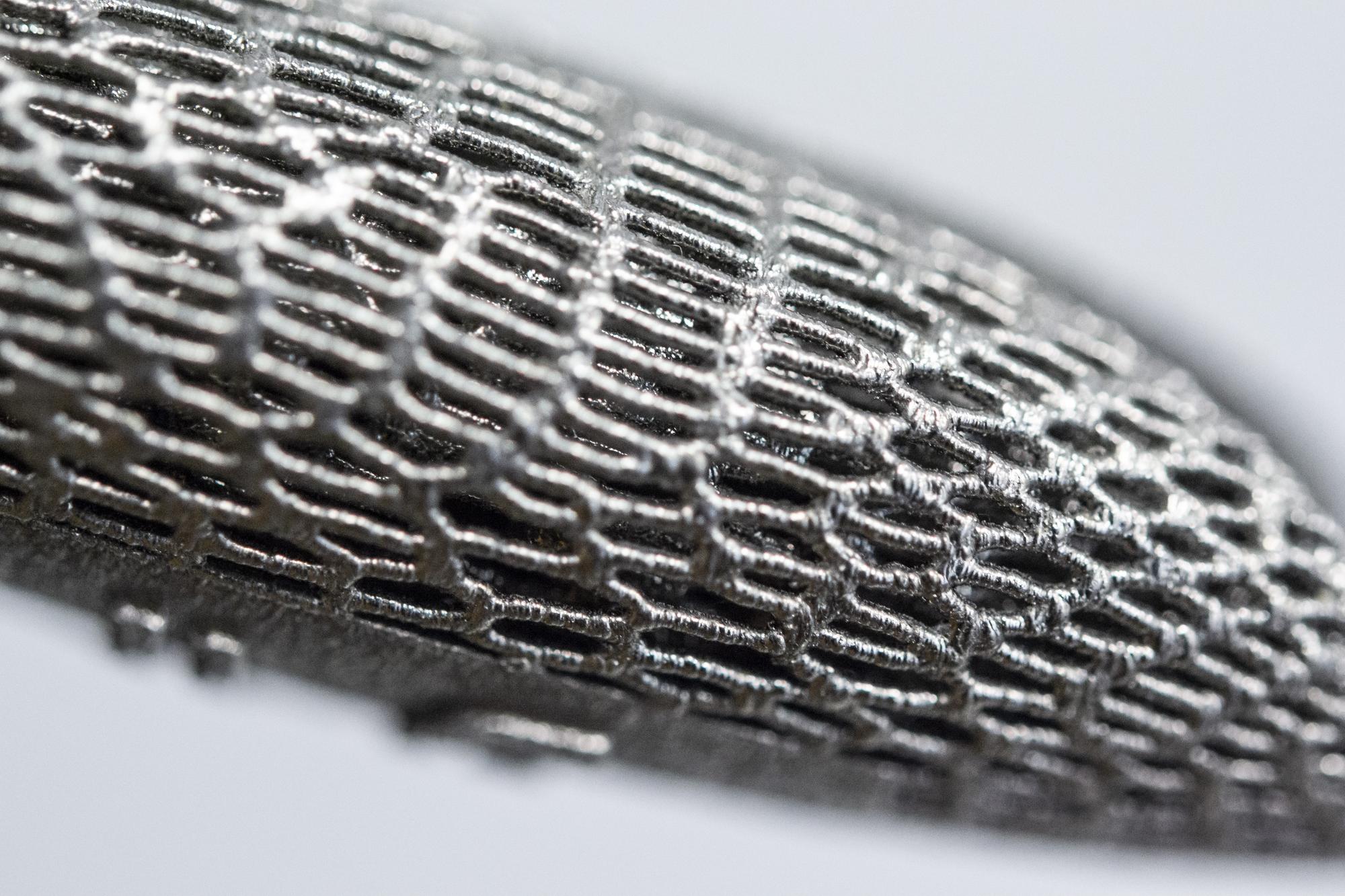 close-up of futuristic embroidered pattern with metallic threads